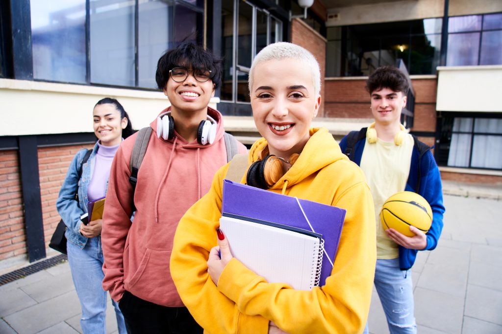 Portrait of a group of students looking at the camera. Young people of different ethnicities posing for the photo. Back to school. High quality photo