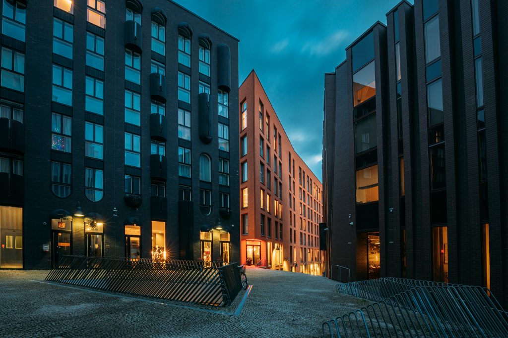 Tallinn, Estonia. View Of Historical Rotermann City In Evening Illuminations. Rotermann Quarter Includes Old Industrial Buildings With New Function And Modern Architecture.